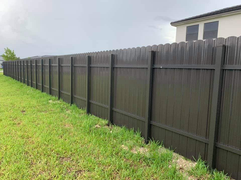 Professional fence installation and repair crew at work