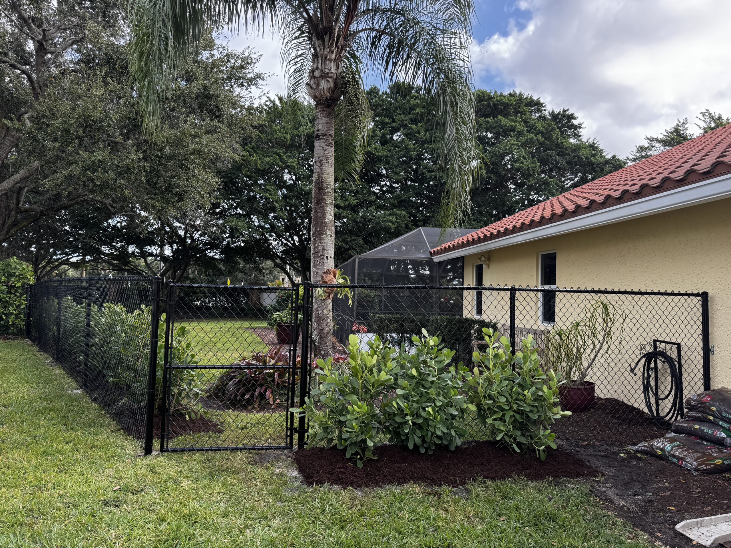 Residential chain link fence installation in Fort Lauderdale for backyard safety and pet containment