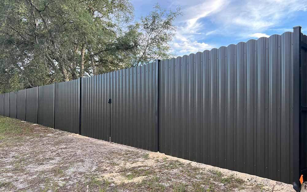 Commercial steel panel fence installation