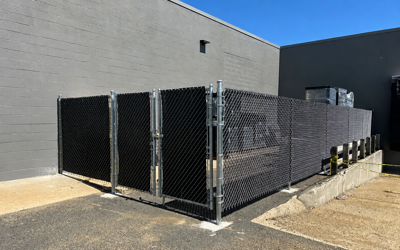 Commercial dumpster fence installation by Saylor Fence serving Davie and Fort Lauderdale